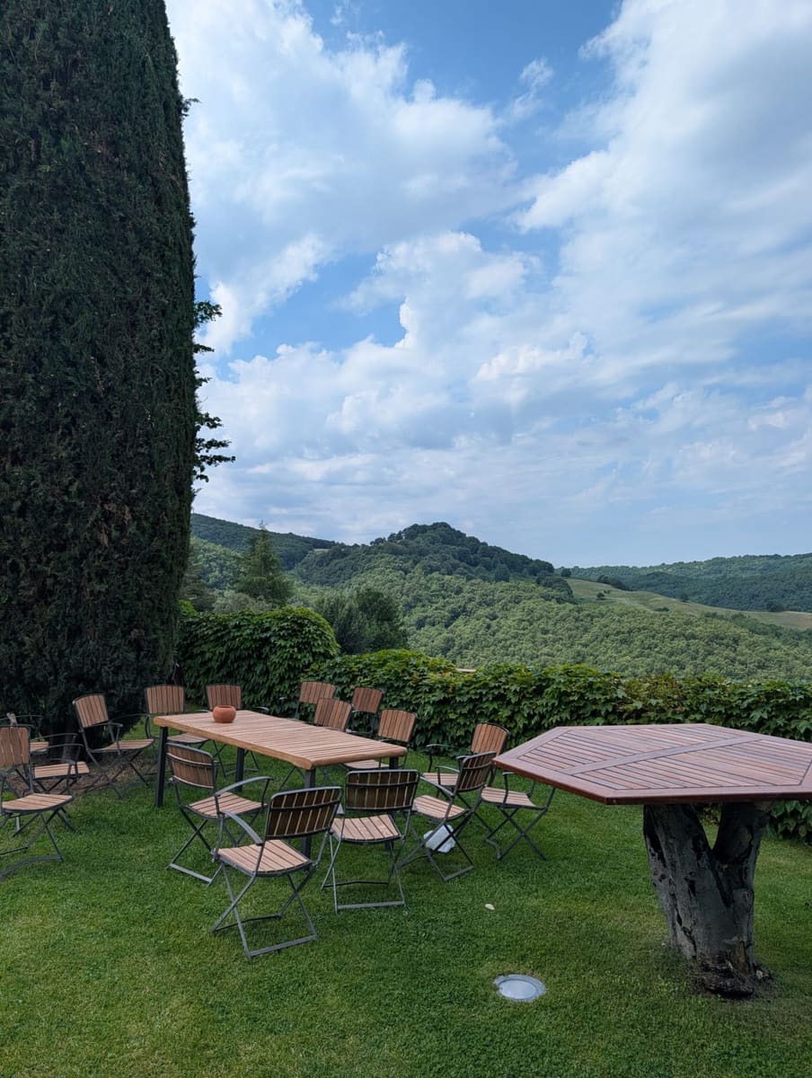 Open-air tables overlooking the Umbrian hills at our offsite venue