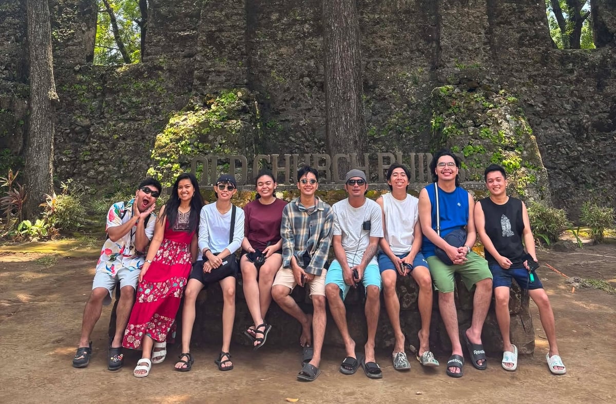 The NorthQA team at the Old Church Ruins in Camiguin